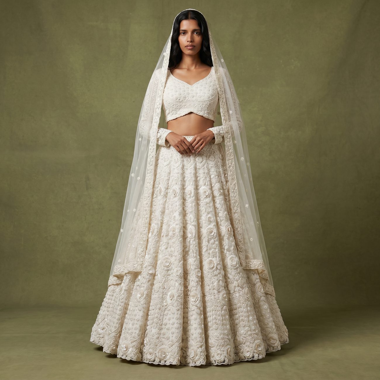 JMS Studio model in an ivory 3D-floral cutdana lehenga